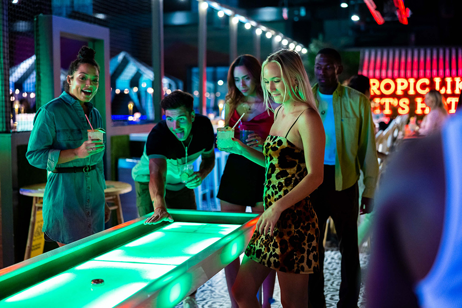 Group playing air hockey at Throw Social DC