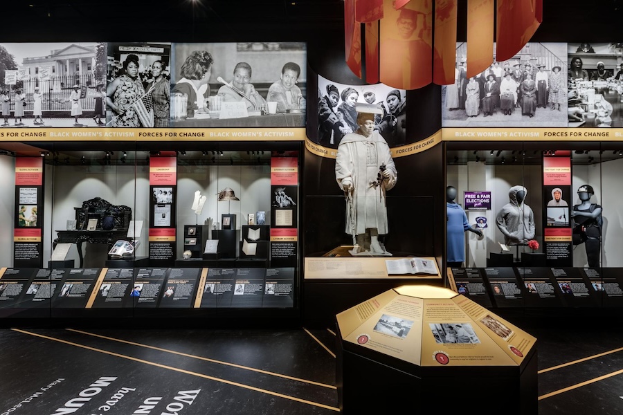 Exhibit on Black women's activism, featuring historical photographs, artifacts, and informational displays at a museum.