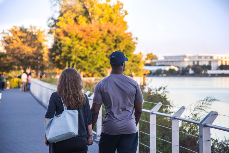 Couple walking along theGeorgetown Waterfront - Romantic spots in Washington, DC